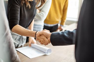 PeakAvenue business partners and customers Two people shake hands