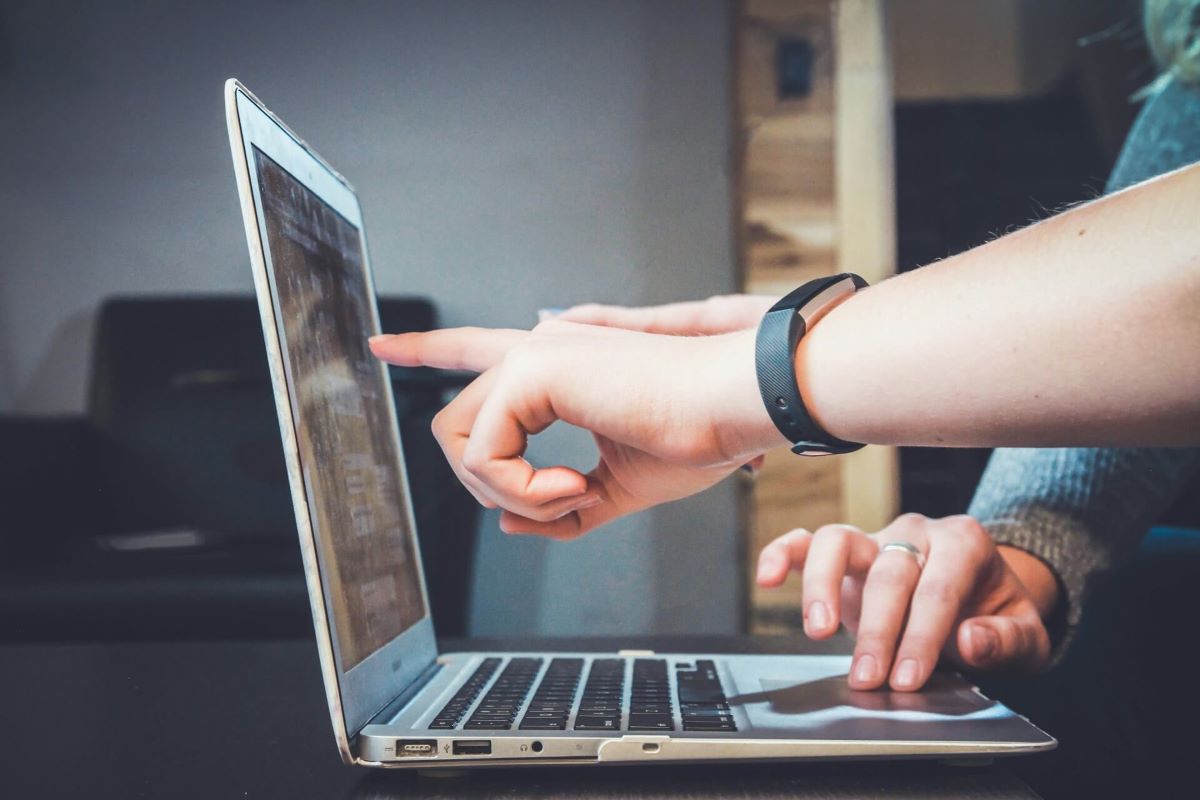 Hands working on a labtop